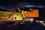 mining truck and excavator at night